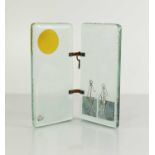 A Studio Glass sculpture, the two joined glass panels depicting two figures on one side, and the sun