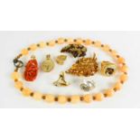 A group of costume jewellery including vintage brooches, coral pendants, quartz necklace, rings