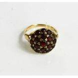 A 9ct gold and garnet cluster ring, 4.7g.