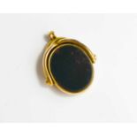 An antique 10ct gold swivel fob with inset bloodstone and sardonyx, 9.8g.