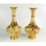 A pair of peach ground vases, painted decoration, flared neck, puce mark for 1900s, 27cm high.