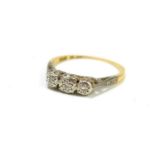 An 18ct gold ring set with three small diamonds, size L, 1.8g.