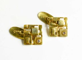 A pair of yellow metal and diamond designer cufflinks of cubist form, 10.1g