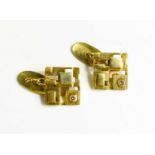 A pair of yellow metal and diamond designer cufflinks of cubist form, 10.1g