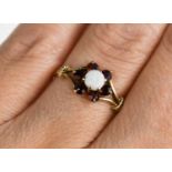 A 9ct gold, opal and garnet set flower head cluster ring, size N, 1.3g