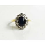 A gold (tests as 18ct) sapphire and diamond dress ring, size M, 4.16g.