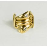 A gold and diamond snake ring, tested to at least 14ct, the two snake heads inset with diamonds