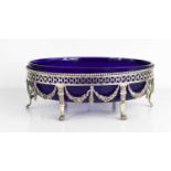 A Regency period silver and blue glass lined bowl, the silver stand having a pierced decorative