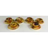A fine set of six Royal Worcester miniature cups and saucers, decorated to a mossy ground, painted