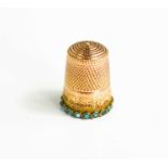 A 9ct gold, and turquoise thimble, Birmingham 1880, with chased decoration, 4.7g.
