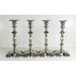 A fine set of four silver hallmarked 19th century candlesticks, and sconces, each hallmarked