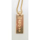 A 9ct gold ingot pendant and necklace, 6.6g