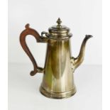 A silver coffee pot, with wooden handle, London 1963, 18.63toz.