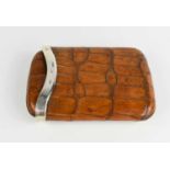 A vintage crocodile skin and silver mounted cigar case / pouch.