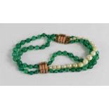 An Art Deco 9ct gold, pearl and green stone beaded bracelet 20cm long.