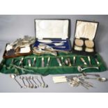 A pair of silver clothes brushes in presentation box, a silver plated serving set, silver spoon, and