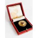 A 9ct gold pill box and lid, by Cartier, the box and lid stamped 375, and initialled, in the
