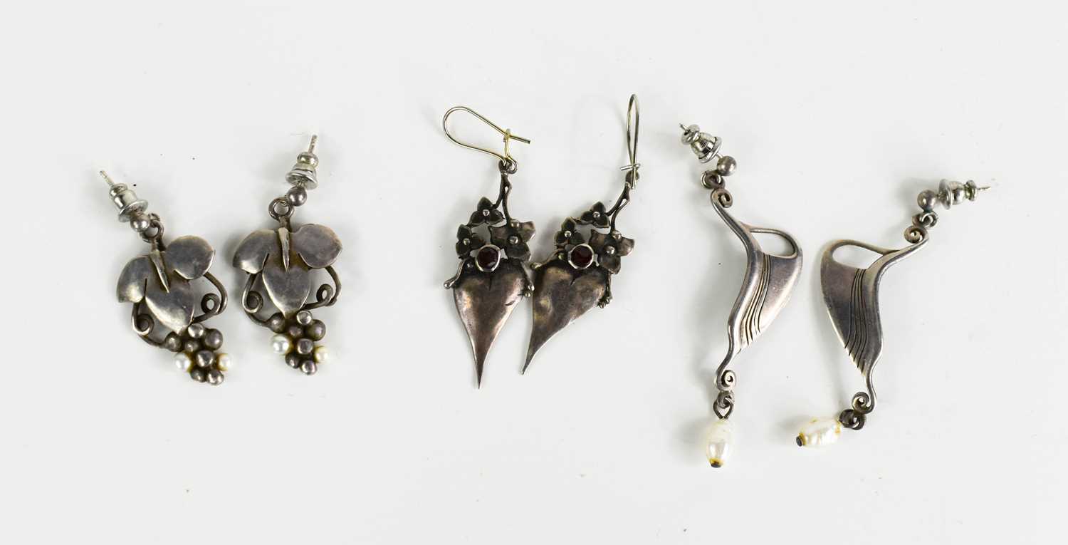 Three pairs of silver pendant earrings, in the Art Nouveau style.