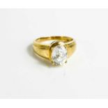 A 9ct gold and oval paste ring, possibly cubic zirconia, size R, 5.7g.