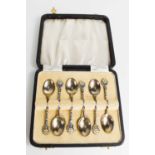 A set of six silver and enamel teaspoons, the handles depicting daisies, Birmingham 1949, boxed, 1.