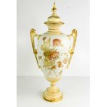 A Royal Worcester vase and cover by Edward Raby, painted with floral design, on an ivory ground,