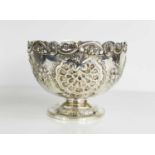 A silver pedestal bowl embossed with shell motifs and having a pierced sea scroll and floral