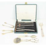 A cased set of Mappin and Webb silver handled butter knives together with two silver sugar tongs,