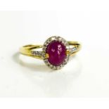 A 9ct gold cabochon ruby and diamond ring, size R, 2.44g