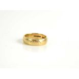 A 9ct gold wedding band, with engraved detail, size R, 5.4g.
