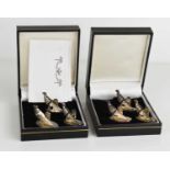 A set of six white metal partridge form place settings, in two presentation boxes.