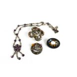 A silver and agate brooch, silver thistle brooch, silver and amethyst necklace, and marble brooch,