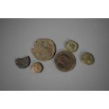 A small group of token and coins to include three Roman examples.