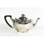 A silver teapot, with ebonised handle, Birmingham 1913, makers initials B.P.S.L, 18.70toz.