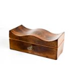 A 19th century mahogany vanity box with serpentine moulded top, mirrored inside lid and key, 16cm by
