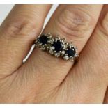 An 18ct gold, diamond and sapphire ring, size M, 3.5g.