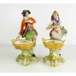 A pair of 19th century Minton figures, circa 1830 of the Grape and Flower gatherers, with baskets,