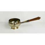 A silver gravy ladle, with treen turned handle, London 1979, 7.8toz.