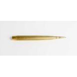 A 9ct gold propelling pencil by Samson & Mordon, stamped 375, 33.3g in total.
