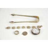 A group of silver items to include a pair of sugar nips, silver pocket watch, filigree necklace