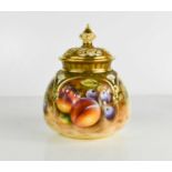 A Royal Worcester quarter lobed vase and cover painted with fruit by Roberts, black Worcester