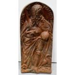 A cast iron plaque depicting Charlemagne holding an orb and sword with a goose at his feet, 44cm
