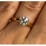 An 18ct yellow gold, platinum and six claw solitaire diamond ring, the diamond approximately 1ct,