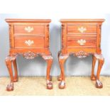 A pair of carved and mahogany bedside table chests, with drawers, on cabriole legs, each measure