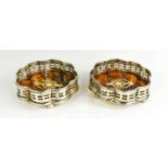 A pair of silver plated and faux tortoiseshell multifoil coasters, the faux tortoiseshell