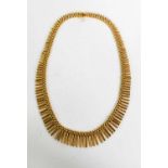An 18ct gold Egyptian style articulated fringe necklace, 50g.