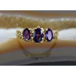 A 9ct gold Victorian style oval cut amethyst ring, size R, 2.38g.