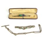 A silver filigree bow form bracelet, an Art Nouveau style multi coloured cut glass brooch in a