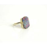 A black opal doublet ring set in unmarked white gold, stone approximately 13 by 20mm, size K, 3.0g.