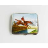 A silver and enamel cigarette case, Birmingham 1918, with a race horse and jockey jumping over