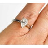 An 18ct white gold and pear cut diamond solitaire ring, the diamond approximately 1.04ct,colour D,